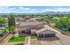 Luxurious home featuring a perfectly manicured lawn,desert landscaping and mature trees at 1919 Belcastro St, Las Vegas, NV 89117