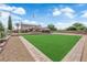 Spacious two-story home with a well-manicured lawn and symmetrical landscaping in a quiet suburban neighborhood at 1919 Belcastro St, Las Vegas, NV 89117