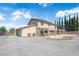 Rear exterior of the home with expansive patio and landscaping at 1919 Belcastro St, Las Vegas, NV 89117