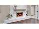 Close up of a white brick fireplace with wooden mantel at 1919 Belcastro St, Las Vegas, NV 89117