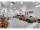 Spacious garage interior offering ample storage, a car under repair, and decorative racing memorabilia at 1919 Belcastro St, Las Vegas, NV 89117