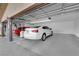 Interior of a garage with space for two cars, featuring an automatic door and a clean, organized layout at 1919 Belcastro St, Las Vegas, NV 89117