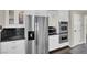 Bright kitchen featuring stainless steel appliances, granite countertops, and white cabinetry at 1919 Belcastro St, Las Vegas, NV 89117