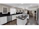 Modern kitchen with white cabinets, island cooktop, and stainless steel appliances at 1919 Belcastro St, Las Vegas, NV 89117