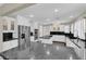 Bright kitchen with white cabinetry, black countertops, and stainless steel appliances at 1919 Belcastro St, Las Vegas, NV 89117