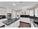 Spacious kitchen featuring an island cooktop and a suite of stainless steel appliances at 1919 Belcastro St, Las Vegas, NV 89117