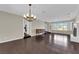 Spacious living room with hardwood floors and natural light from the large bay windows at 1919 Belcastro St, Las Vegas, NV 89117