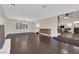 Open concept living room with fireplace, hardwood floors, and staircase at 1919 Belcastro St, Las Vegas, NV 89117