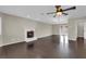 Large living room showcasing hardwood floors, a fireplace, and a modern ceiling fan at 1919 Belcastro St, Las Vegas, NV 89117