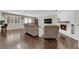 Expansive living room with dark hardwood floors and abundant natural light at 1919 Belcastro St, Las Vegas, NV 89117