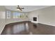 Spacious living room with hardwood floors, fireplace and views from multiple windows at 1919 Belcastro St, Las Vegas, NV 89117