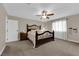 Cozy bedroom featuring plush carpeting, natural light, and decorative wooden bed frame at 1919 Belcastro St, Las Vegas, NV 89117