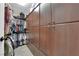 Spacious walk-in closet with custom storage cabinets and rods at 1919 Belcastro St, Las Vegas, NV 89117