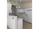 Bright, functional kitchen with white cabinets, tile backsplash and modern appliances for easy meal prep at 2050 N Los Feliz St # 114, Las Vegas, NV 89156