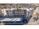 Aerial view showcasing a well-maintained condo community with carports and desert landscaping at 2068 Mesquite Ln # 203, Laughlin, NV 89029