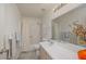 Clean bathroom features a shower-tub combo and a wide vanity with ample lighting at 2068 Mesquite Ln # 203, Laughlin, NV 89029