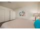 Bright bedroom with a patterned bedspread, sliding closet doors, and ambient lighting at 2068 Mesquite Ln # 203, Laughlin, NV 89029