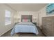 Cozy bedroom featuring a comfortable bed, two side tables with lamps, and calming decor at 2068 Mesquite Ln # 203, Laughlin, NV 89029