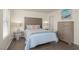 Cozy bedroom featuring a comfortable bed, two side tables with lamps, and calming decor at 2068 Mesquite Ln # 203, Laughlin, NV 89029
