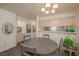 Inviting dining room featuring a gray table set, pendant lighting and views of the kitchen at 2068 Mesquite Ln # 203, Laughlin, NV 89029