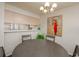 Inviting dining room featuring a gray table set, pendant lighting and wall art at 2068 Mesquite Ln # 203, Laughlin, NV 89029