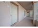 Hallway featuring the front door to unit 203, with secure entry gate and a small window at 2068 Mesquite Ln # 203, Laughlin, NV 89029