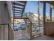 Metal exterior staircase with palm tree views, carports, and desert landscape at 2068 Mesquite Ln # 203, Laughlin, NV 89029