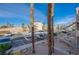 Exterior view featuring palm trees, carports, and an external staircase to condo units at 2068 Mesquite Ln # 203, Laughlin, NV 89029
