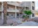 Exterior staircase leading to a condo with desert landscaping and gravel at 2068 Mesquite Ln # 203, Laughlin, NV 89029