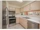 Bright kitchen featuring stainless steel appliances, stainless steel sink and light wood cabinets at 2068 Mesquite Ln # 203, Laughlin, NV 89029