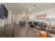 Open-concept living area with a brown sofa, bar seating, and access to the kitchen at 2068 Mesquite Ln # 203, Laughlin, NV 89029