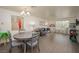 Comfortable living room featuring a dining table, dark wood floors, a leather sofa and natural light at 2068 Mesquite Ln # 203, Laughlin, NV 89029