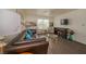 Inviting living room featuring a leather sofa, modern decor, and natural light from the window at 2068 Mesquite Ln # 203, Laughlin, NV 89029