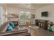 Inviting living room featuring a leather sofa, modern decor, and natural light from the window at 2068 Mesquite Ln # 203, Laughlin, NV 89029