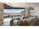 Bright bedroom with sliding glass doors to the outside, comfortable bed, and desert landscape views at 21 Rockstream Dr, Henderson, NV 89012