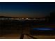 A twilight view of the city lights from the rooftop pool area at 21 Rockstream Dr, Henderson, NV 89012