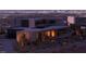 Modern home exterior showing a rooftop, elegant design, and city views at 21 Rockstream Dr, Henderson, NV 89012