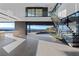 Bright living area featuring a staircase and scenic views at 21 Rockstream Dr, Henderson, NV 89012