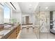 Modern main bathroom features marble accents, a glass shower, and double vanity at 21 Rockstream Dr, Henderson, NV 89012