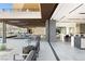 Spacious patio with ample seating, outdoor dining area, and sleek modern design at 21 Rockstream Dr, Henderson, NV 89012