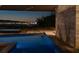 Stunning pool view at dusk, showcasing the city lights and serene ambiance at 21 Rockstream Dr, Henderson, NV 89012