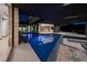 Stunning dark bottom pool view with desert landscaping and luxurious home design at 21 Rockstream Dr, Henderson, NV 89012