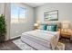 Bedroom featuring a well-made bed, stylish decor, and a bright window at 2175 Limestone Cove Ct, Laughlin, NV 89029