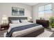 Bedroom showcasing a well-made bed, stylish decor, and a bright window at 2175 Limestone Cove Ct, Laughlin, NV 89029