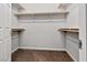 Walk-in closet with built-in shelving and a neutral-toned carpet at 2175 Limestone Cove Ct, Laughlin, NV 89029