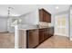 Modern kitchen featuring stainless steel appliances, granite countertops, and tile flooring at 2175 Limestone Cove Ct, Laughlin, NV 89029