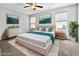 Inviting main bedroom featuring neutral tones, elegant decor, and abundant natural light at 2175 Limestone Cove Ct, Laughlin, NV 89029