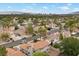 Neighborhood aerial view showcases residential homes, desert landscaping and city skyline backdrop at 2344 Valleywood St, Henderson, NV 89014