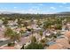 Neighborhood aerial view showcases residential homes, community pool, landscaping and city skyline backdrop at 2344 Valleywood St, Henderson, NV 89014