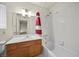 Bathroom with a single sink, showerhead, and decorative shower curtain over tub at 2344 Valleywood St, Henderson, NV 89014